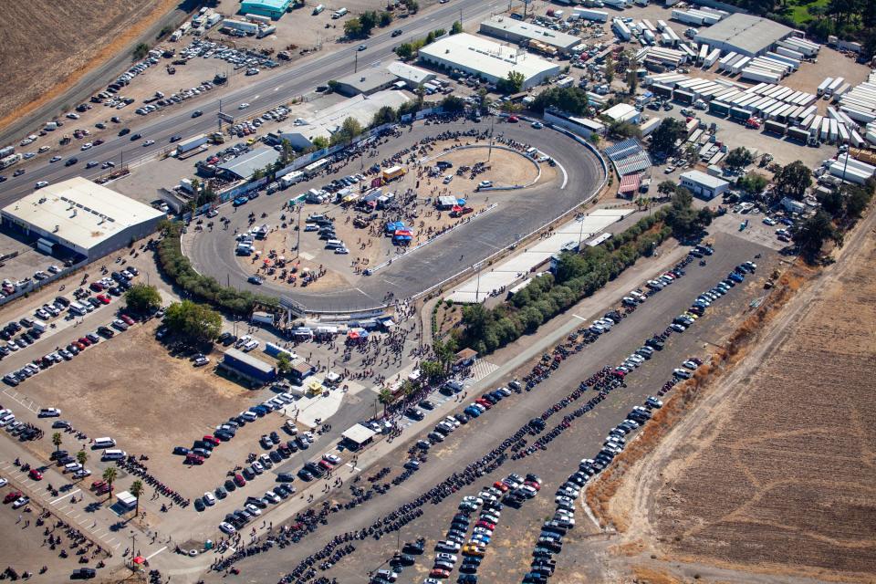 Motorcycles and cars line Stockton 99 Speedway, the site for the funeral of Ralph "Sonny" Barger, founding member of the Oakland chapter of the Hells Angels Motorcycle Club.