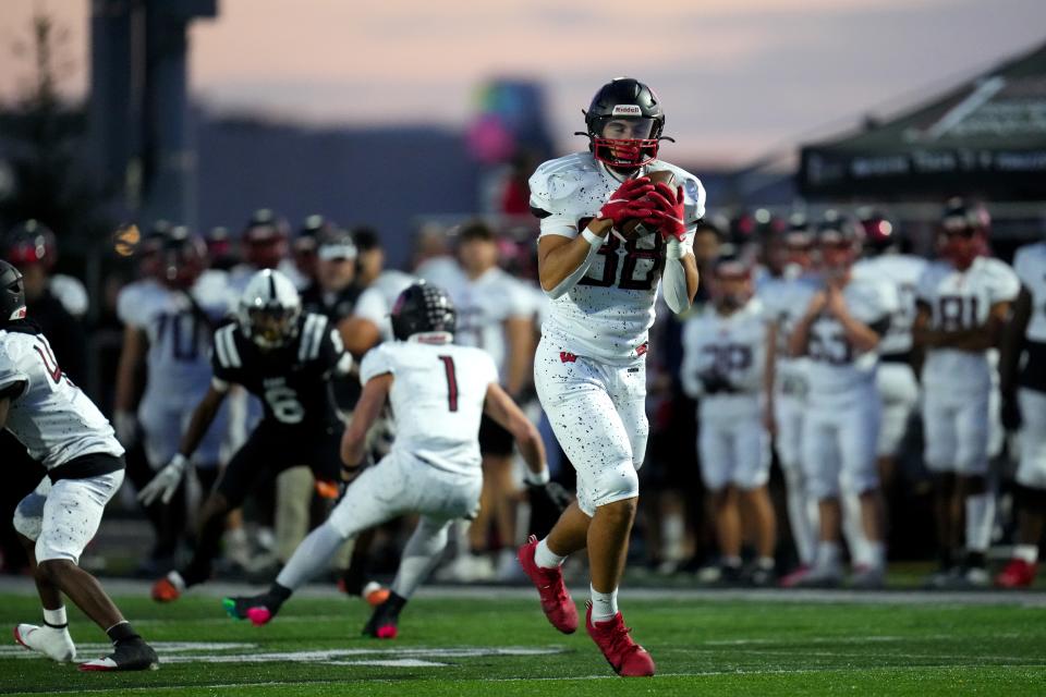 Lakota West Firebirds tight end Luka Gilbert (88) catches a pass in the first half of a high school football game between the Lakota West Firebirds and the Lakota East Thunderhawks, Friday, Oct. 6, 2023, at Lakota East High School in Liberty Township, Ohio.