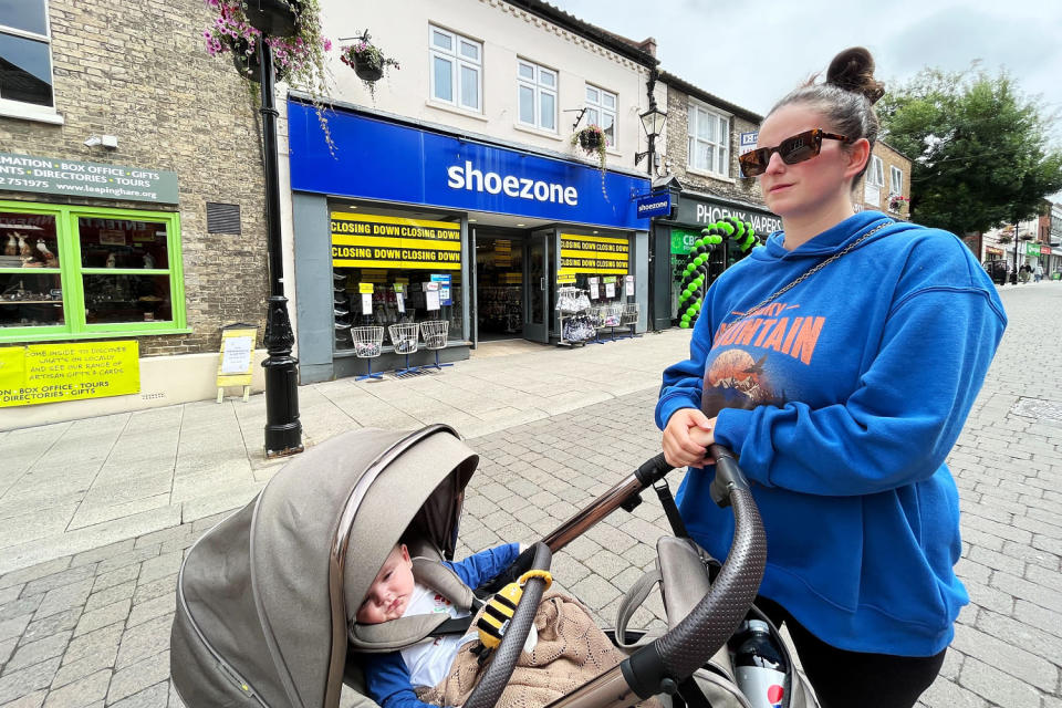 Lucy Howe, 26, with her son Louis on Thetford High Street in Norfolk, eastern England, on July 5. (Alex Smith / NBC News)
