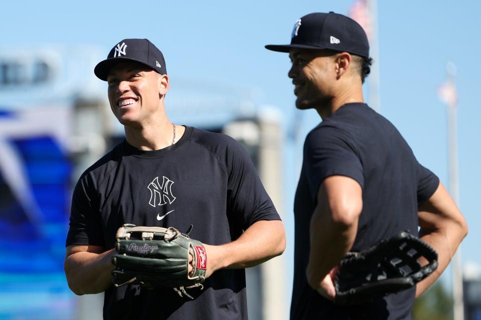 Feb 19, 2024; Tampa, FL, USA; New York Yankees right fielder Aaron Judge (99) and outfielder Giancarlo Stanton (27) participate in spring training workouts at George M. Steinbrenner Field. Mandatory Credit: Nathan Ray Seebeck-USA TODAY Sports