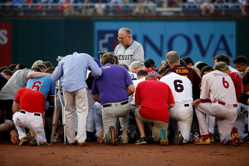 <p>Patrick Conroy, Chaplain of the House of Representatives, leads Democrats and Republicans in prayer before they face off in the annual Congressional Baseball Game at Nationals Park in Washington, June 15, 2017. (Photo: Joshua Roberts/Reuters) </p>
