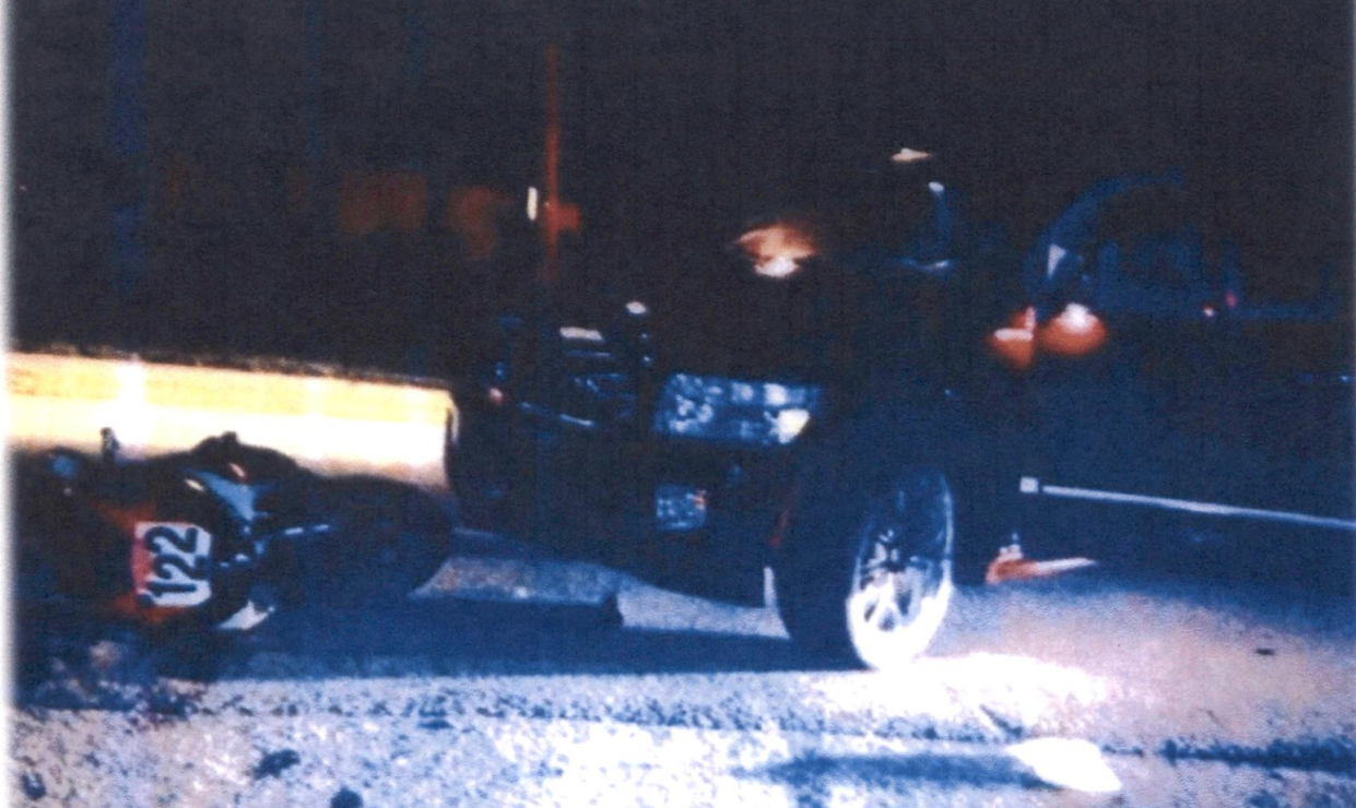 This is a crash-scene evidence photo from June 16, 2013, showing Scott Winckler's Suzuki motorcycle and the other vehicle involved.