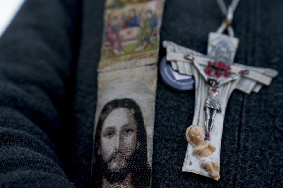 <p>A woman wears religious paraphernalia as she attends a rally on the National Mall in Washington, Friday, Jan. 19, 2018, during the annual March for Life. (Photo: Andrew Harnik/AP) </p>