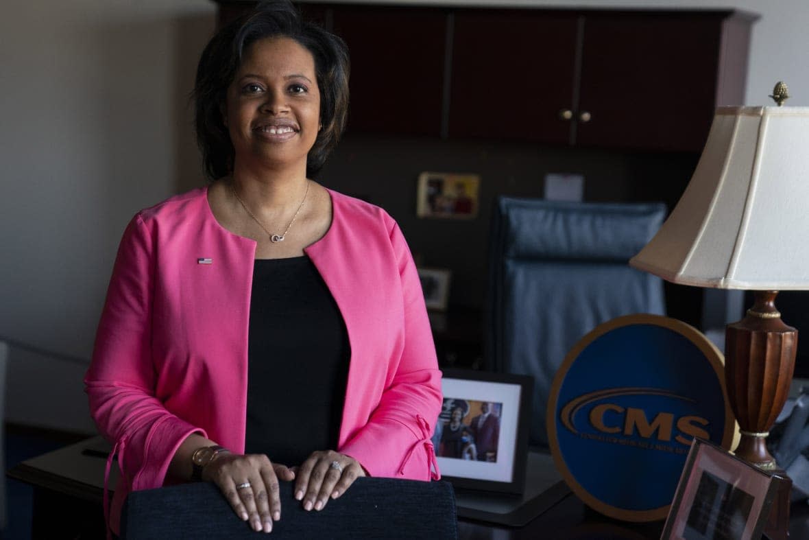 Chiquita Brooks-LaSure, the Administrator for the Centers of Medicare and Medicaid Services, poses for a photograph in her office, Feb. 9, 2022, in Washington. (AP Photo/Evan Vucci, File)