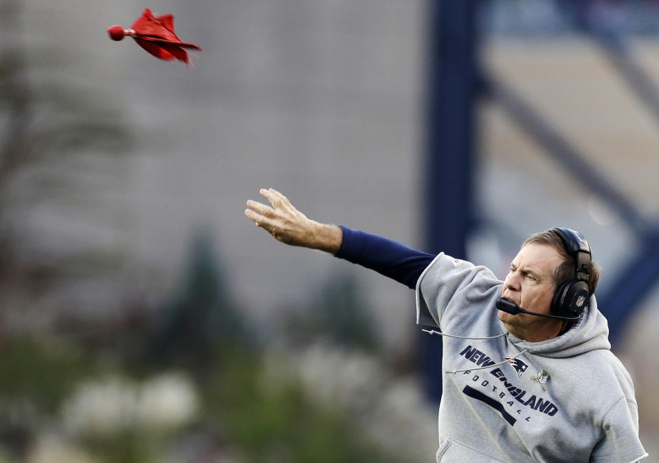 New England Patriots head coach Bill Belichick throws the flag on a coach's challenge on a fumble by the Buffalo Bills during the fourth quarter of an NFL football game at Gillette Stadium in Foxborough, Mass., Sunday, Nov. 11, 2012. (AP Photo/Elise Amendola)