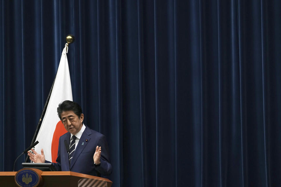 Japanese Prime Minister Shinzo Abe delivers his speech at the Prime Minister's office in Tokyo Saturday, Feb. 29, 2020. During the speech Abe said that his government will create another emergency package totaling over 270 billion yen ($2.5 billion) from reserve funds to prevent the spread of the new coronavirus, local media said. (AP Photo/Eugene Hoshiko)