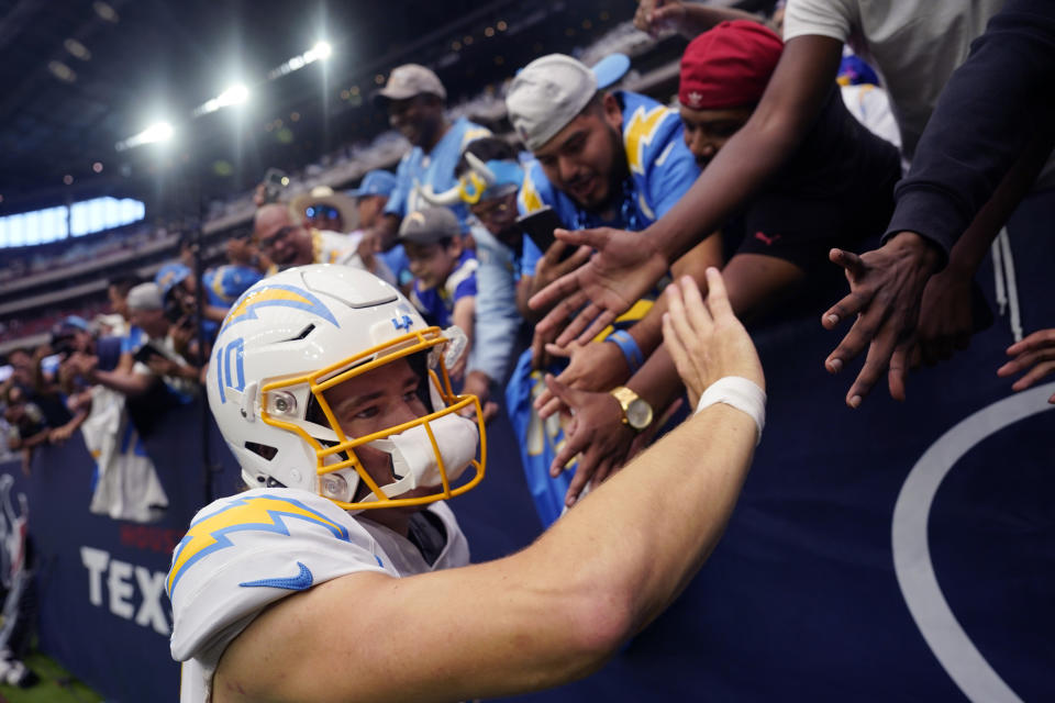 Los Angeles Chargers quarterback Justin Herbert (10) acknowledges fans after an NFL football game against the Houston Texans, Sunday, Oct. 2, 2022, in Houston. (AP Photo/David J. Phillip)