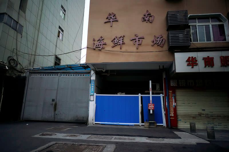 FILE PHOTO: A blocked entrance to Huanan seafood market is seen in Wuhan