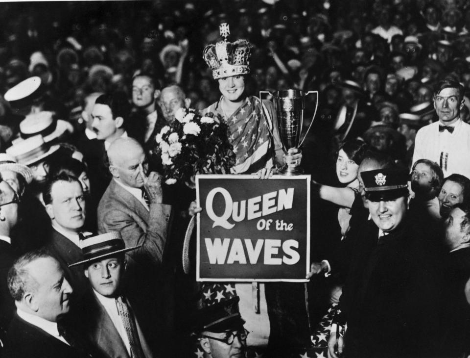 American swimmer Gertrude Ederle, the first female to swim across the English Channel, is honoured for her historic swim and crowned 'Queen of the Waves', September 8, 1926 in New York City. (Photo by Topical Press Agency/Getty Images)