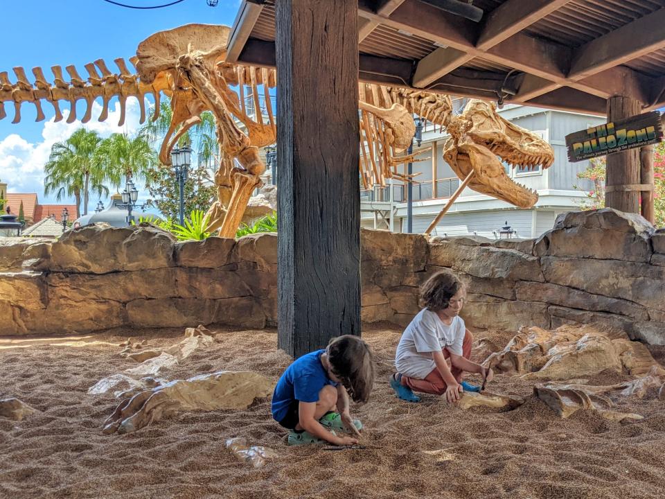 kids playing in the digging area at the t rex cafe in disney springs 