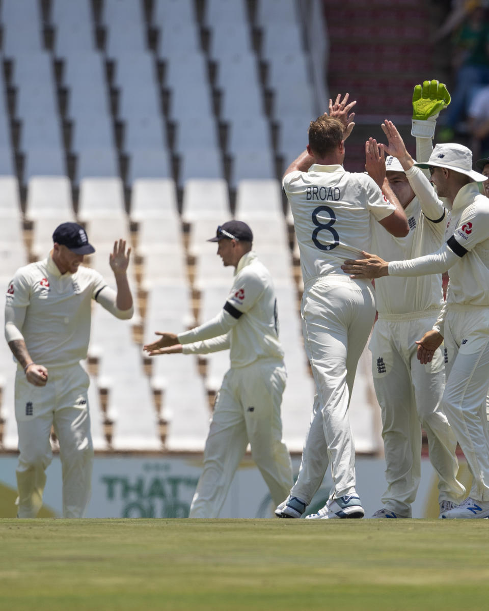 England's bowler Stuart Broad, middle, celebrates with teammates after dismissing South Africa's Zubayr Hamza for 39 runs on day one of the first cricket test match between South Africa and England at Centurion Park, Pretoria, South Africa, Thursday, Dec. 26, 2019. (AP Photo/Themba Hadebe)