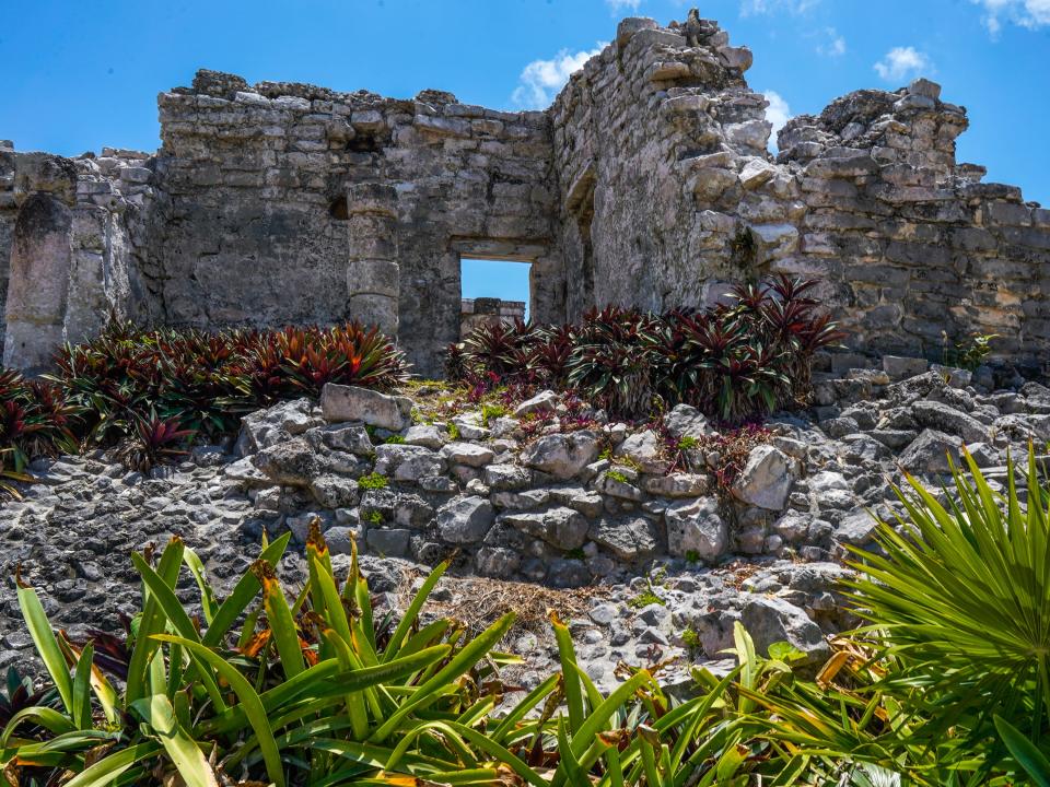 Mayan ruins in Tulum on a partly-cloudy day
