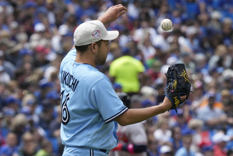 Toronto Blue Jays starting pitcher Yusei Kikuchi reacts on the mound after Atlanta Braves' Ozzie Albies hit a two-run home run during third-inning baseball game action in Toronto, Ontario, Sunday, May 14, 2023. (Frank Gunn/The Canadian Press via AP)