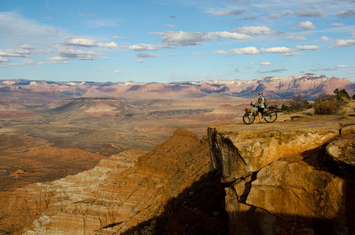 A cyclist rests along the Gooseberry Mesa National Recreation Trail