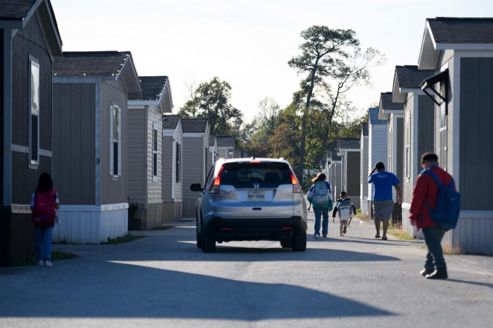 Children return home from school in Channelview, Texas.