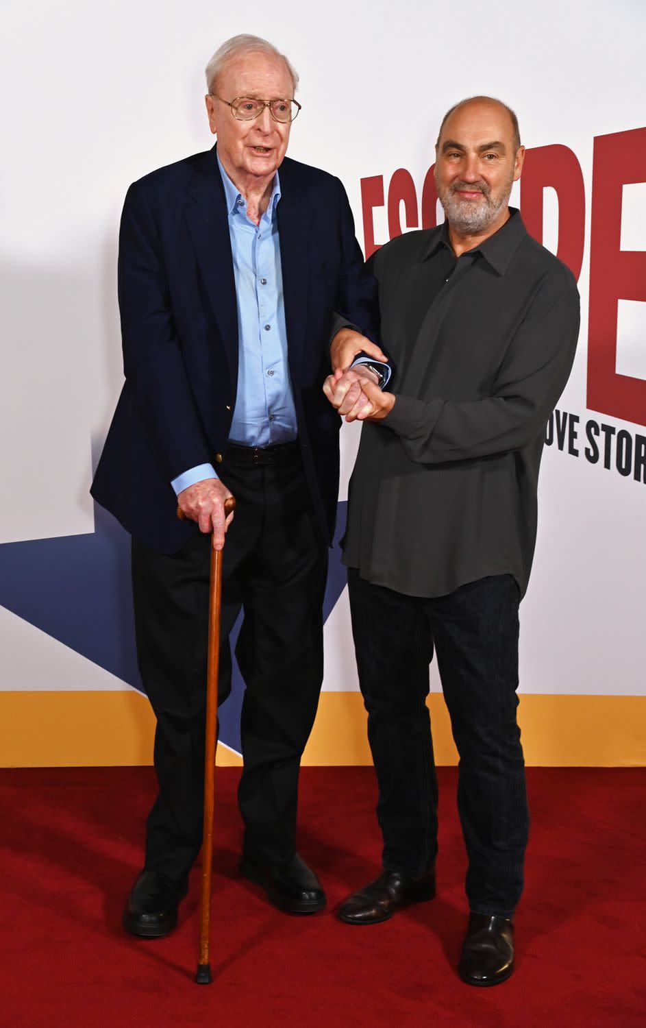 <p>Dave Benett/WireImage</p> Michael Caine and director Oliver Parker on Sept. 20, 2023.