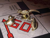 <p> This March 15, 2017 photo shows the three new tokens in Atlantic City, N.J., that fans from around the world have voted into upcoming editions of the board game Monopoly: a duck, a T-Rex dinosaur and a penguin. Hasbro Inc. revealed the results of voting on Friday, March 17, 2017. Leaving the game will be the boot, wheelbarrow and thimble tokens. (AP Photo/Wayne Parry) </p>