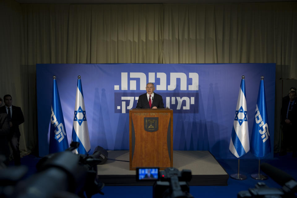 Israeli Prime Minister Benjamin Netanyahu, center, gestures as he delivers a statement at the Prime Minister's residence in Jerusalem, Thursday, Feb. 28, 2019. Israel's attorney general on Thursday recommended indicting Prime Minister Benjamin Netanyahu with bribery and breach of trust in a series of corruption cases, a momentous move that shook up Israel's election campaign and could spell the end of the prime minister's illustrious political career. (AP Photo/Sebastian Scheiner)