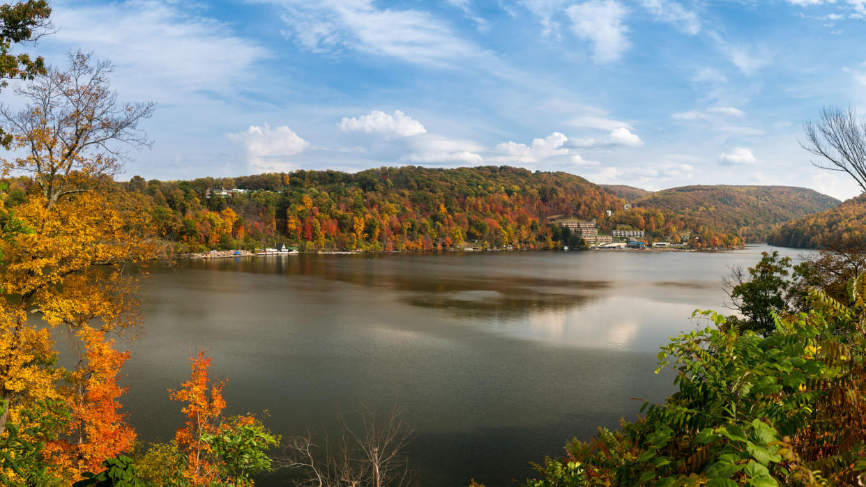 Panorama of the autumn fall colors surrounding Cheat Lake near Morgantown, West Virginia.