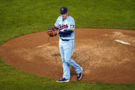 Minnesota Twins pitcher Tyler Duffey pounds his fist into his glove after the Twins defeated the Cincinnati Reds 7-3 in a baseball game Saturday, Sept. 26, 2020, in Minneapolis. (AP Photo/Jim Mone)