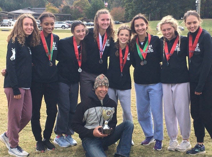 Savannah Arts cross country coach Steve Ricciardi, with trophy, and his Panthers squad that finished second as a team in the GHSA Class 3A state meet in November.