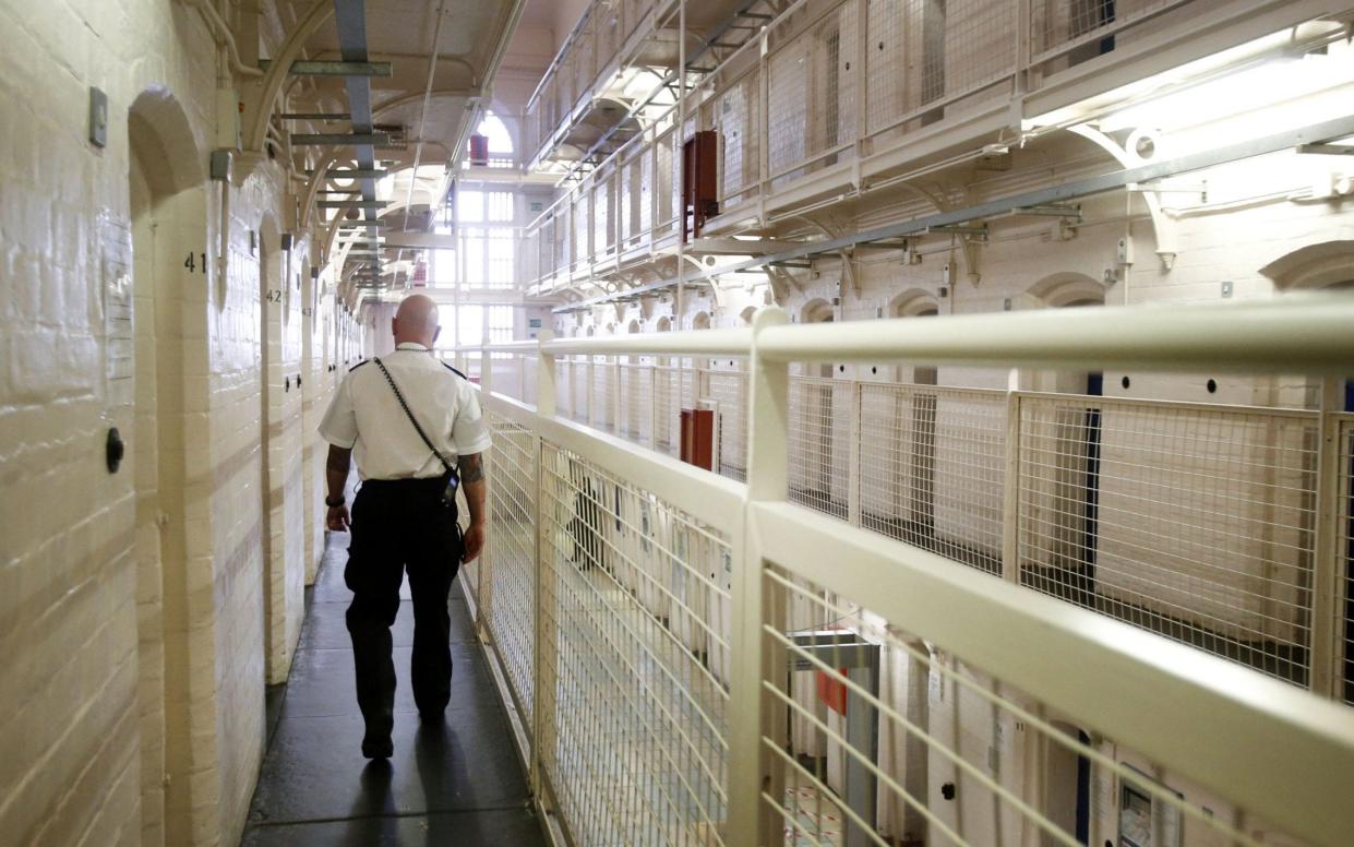 Charlie Taylor said too many prisons had failed to introduce 9am-5pm work-style regimes - PA