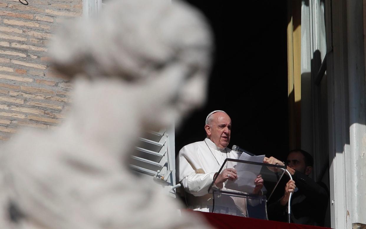 Pope Francis reads the Angelus noon prayer in the Vatican - Alessandra Tarantino/AP