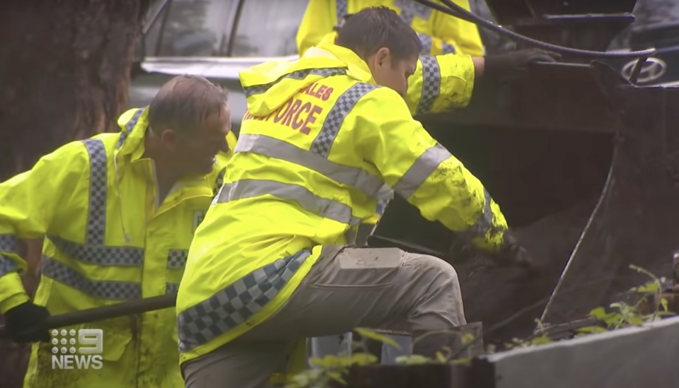Police dig through an excavator during the search for William Tyrrell in Kendall.