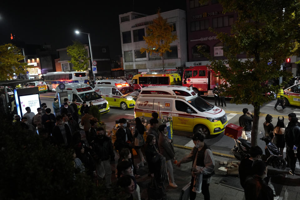 Ambulances carrying victims head to the hospital near the scene in Seoul, South Korea, Sunday, Oct. 30, 2022. At least 146 people were killed and 100 more were injured as they were crushed by a large crowd pushing forward on a narrow street during Halloween festivities in the capital of Seoul, South Korean officials said. (AP Photo/Lee Jin-man)