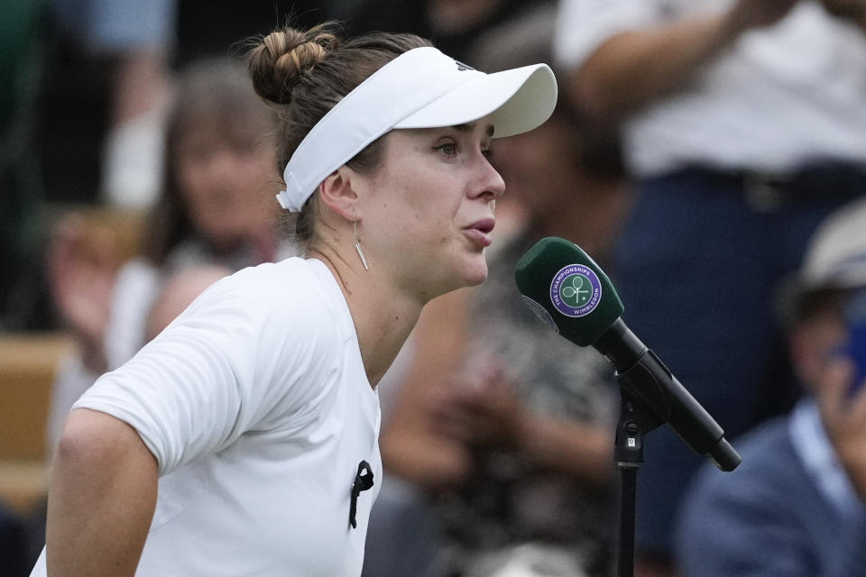 Elina Svitolina of Ukraine addresses the crowd defeating Xinyu Wang of China in their fourth round match at the Wimbledon tennis championships in London, Monday, July 8, 2024. (AP Photo/Mosa'ab Elshamy)