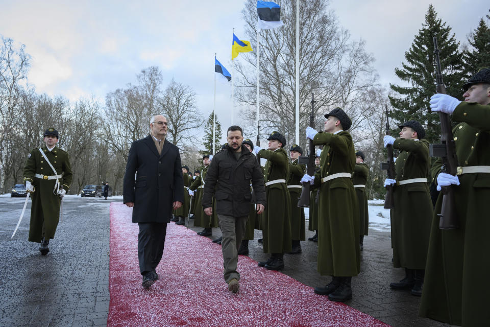 In this photo provided by the Office of the President of the Republic of Estonia, Estonia's President Alar Karis, centre, and Ukrainian President Volodymyr Zelenskyy, centre right, attend a welcoming ceremony, in Tallinn, Estonia, Thursday, Jan.11, 2024. (Raigo Pajula / Office of the President of the Republic of Estonia via AP)