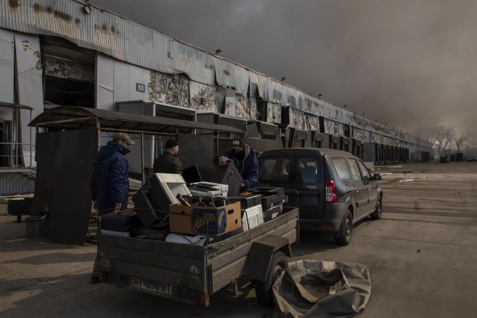 Smoke rises from a destroyed frozen food storage area 