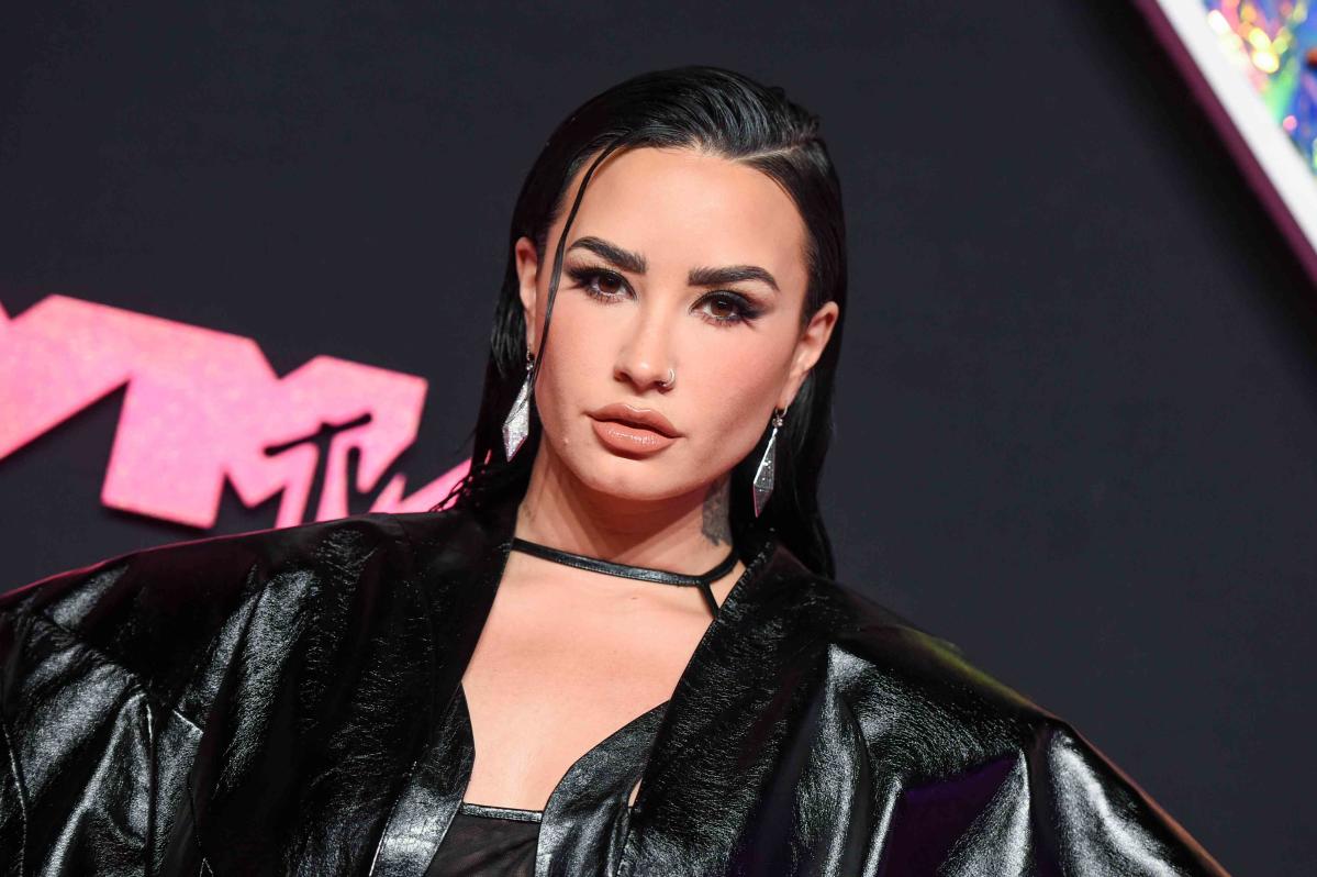 Demi Lovato Gets Cozy in Boots for 'Top of the Mountain' Concert