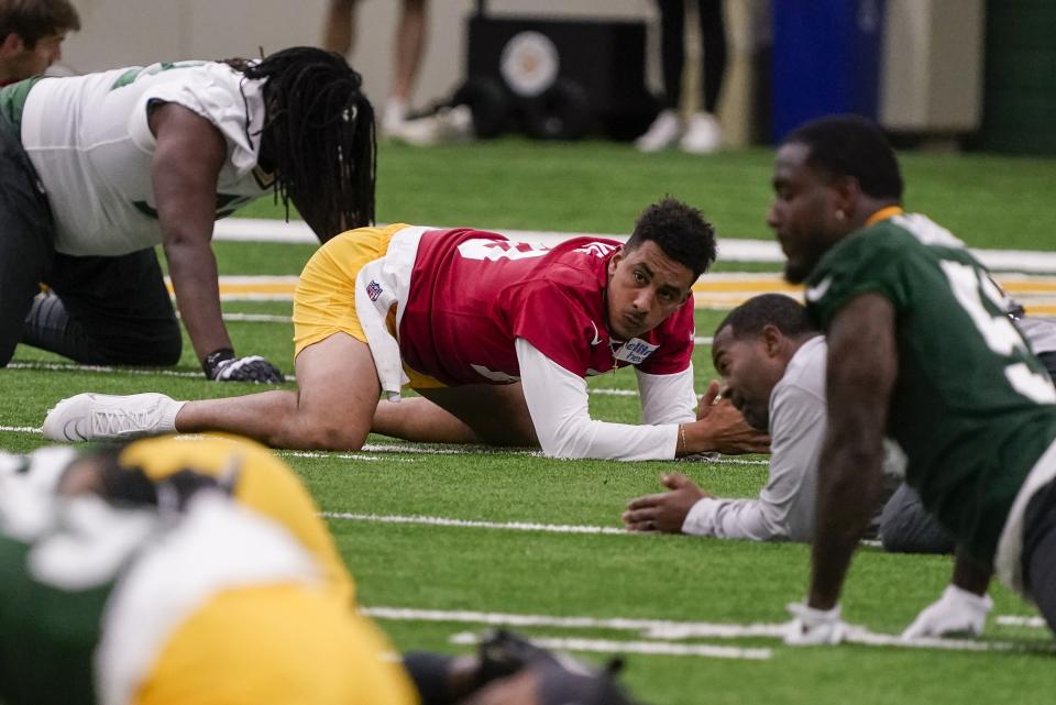 Green Bay Packers' Jordan Love stretches at the NFL football team's practice field training camp Tuesday, May 24, 2022, in Green Bay, Wis. (AP Photo/Morry Gash)