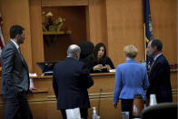 Superior Court Justice Amy Messer conducts a bench meeting with lawyers at jury selection for the Adam Montgomery murder trial at Hillsborough County Superior Court in Manchester, N.H, on Tuesday, Feb. 6, 2024. Montgomery is accused of killing his 5-year-old daughter and spending months moving her body before disposing of it. (David Lane/Union Leader via AP, Pool)