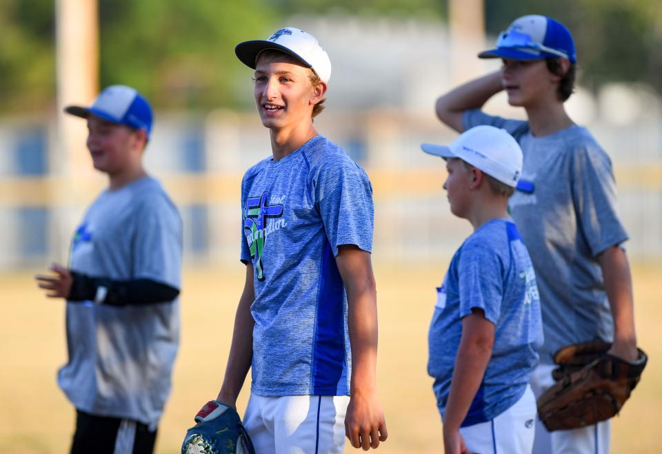 Gavin Weir smiles towards his dad while at tryouts out for a local baseball team on Monday, July 25, 2022, in Harrisburg, SD.