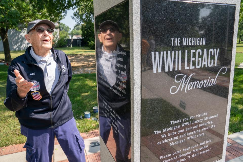 Art Fishman, 96, a Navy WWll veteran from Oak Park, is reflected in a granite column as he visits The Michigan WWll Legacy Memorial on Wednesday, Aug. 9, 2023, at Memorial Park in Royal Oak. The memorial dedication will take place between 4-6 pm on Thursday, Aug. 10, 2023. Fishman will be a guest of honor at the dedication.