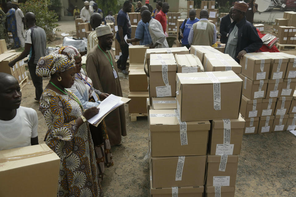 An electoral worker take stock of ballot papers to be transporters at the offices of the Independent National Electoral Commission in Yola, Nigeria, Friday, Feb. 15, 2019. Nigeria surged into the final day of campaigning ahead of Saturday's election, as President Muhammadu Buhari made one last pitch to stay in office while top challenger Atiku Abubakar shouted to supporters: "Oh my God! Let them go! Let them go!" (AP Photo/Sunday Alamba)