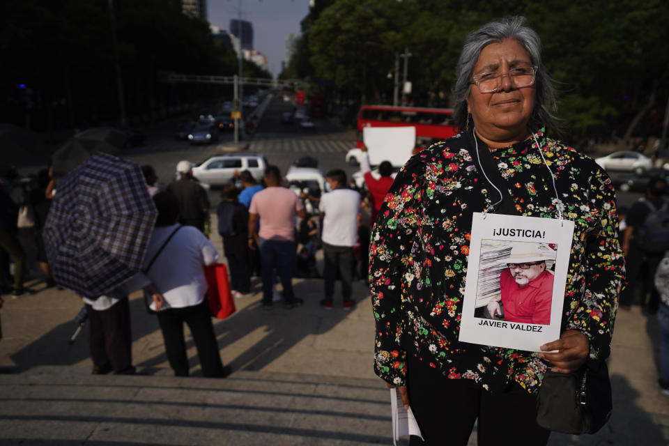 Griselda Triana holds a photo of her husband Javier Valdez who was murdered in Culiacan on May 15, 2017, during a protest to draw attention to the latest wave of murders of journalists, at the Angel of Independence monument in Mexico City, Monday, May 9. May 2022. Two journalists were shot dead in the state of Veracruz, on the coast of the Gulf of Mexico, on Monday, Yessenia Mollinedo Falconi and Sheila Johana García Olivera, director and reporter, respectively, of the online news site El Veraz in Cosoleacaque. (AP Photo/Marco Ugarte)