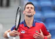 <p>TOKYO, JAPAN - JULY 28: Novak Djokovic of Serbia reacts against Alejandro Davidovich Fokina of Spain during the Men's Singles Third Round Tennis Match on day five of the Tokyo 2020 Olympic Games at Ariake Tennis Park on July 28, 2021 in Tokyo, Japan. (Photo by Wang Xianmin/CHINASPORTS/VCG via Getty Images)</p> 