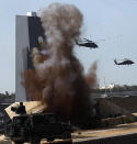 <p><span>Helicopters perform during a military show launching the International Defence Exhibition and Conference (IDEX) at the Abu Dhabi National Exhibition Centre in the Emirati capital on February 17, 2013. </span></p>