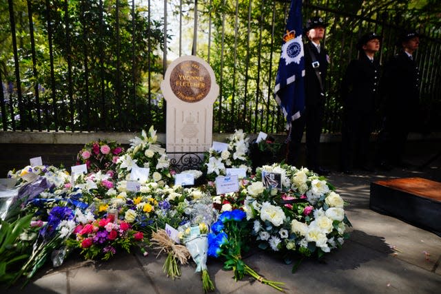 Flowers laid at the memorial stone during the 40th anniversary memorial service for Pc Yvonne Fletcher. Victoria Jones/PA