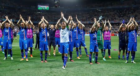 Football Soccer - England v Iceland - EURO 2016 - Round of 16 - Stade de Nice, Nice, France - 27/6/16 Iceland's Aron Gunnarsson and teammates celebrate after the game REUTERS/Michael Dalder Livepic