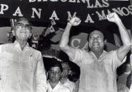 <p>Panama’s newly appointed president, Manuel Solis Palma, stands next to his friend, Gen. Manuel Antonio Noriega, who appointed him during a rally of 2,000 supporters on Feb. 29, 1988. (Beth Cruz/Reuters) </p>