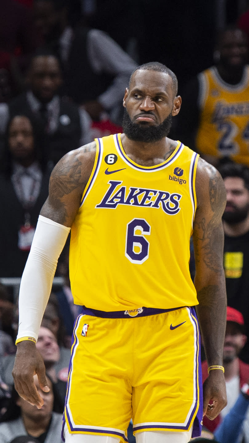 Los Angeles Lakers forward LeBron James reacts during the first half of an NBA basketball game against the Atlanta Hawks, Friday, Dec. 30, 2022, in Atlanta. (AP Photo/Hakim Wright Sr.)