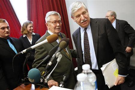 Ambassador Bruce Laingen (3rd L), who was the senior U.S. diplomat in Tehran when he and 51 others were taken prisoner in the Iranian hostage crisis in 1979, and Ambassador John Limbert (R), who served as the Deputy Assistant Secretary of State for Iran during the first Obama administration, wrap up a news conference calling for greater diplomacy between the U.S. and Iran, on Capitol Hill in Washington, February 25, 2013. REUTERS/Jonathan Ernst