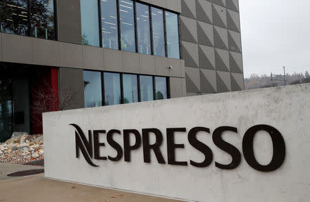 FILE PHOTO: A logo is pictured outside the Nespresso plant, part of food giant Nestle, in Romont, Switzerland, November 19, 2018. REUTERS/Denis Balibouse/File Photo