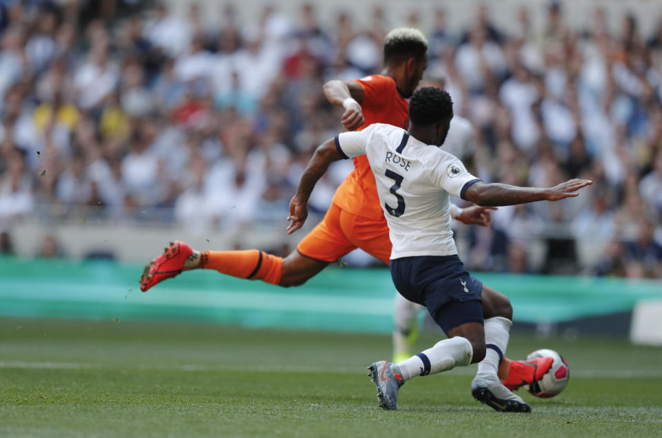 Newcastle's Joelinton, left, scores his side's first goal during the English Premier League soccer match between Tottenham Hotspur and Newcastle United at Tottenham Hotspur Stadium in London, Sunday, Aug. 25, 2019.(AP Photo/Frank Augstein)