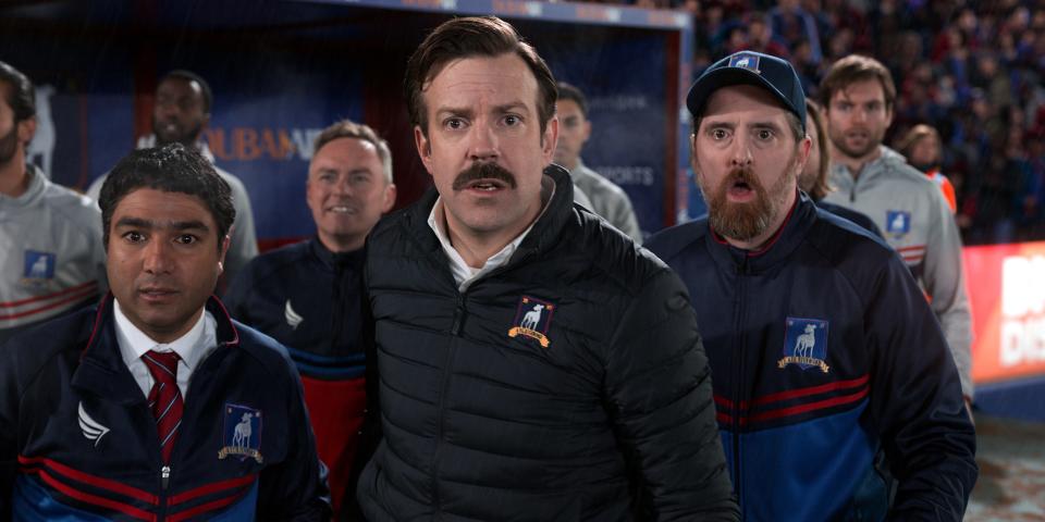 Nate (Nick Mohammed), Ted (Jason Sudeikis) and Beard (Brendan Hunt) take in a different kind of football in Apple TV+'s "Ted Lasso."