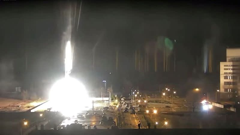 Surveillance camera footage shows a flare landing at the Zaporizhzhia nuclear power plant during shelling in Enerhodar